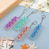 Unzip The Mechanical Keyboard With Light, Press The Keychain, And The Personalized Fully Transparent Light Unzips The Toy Schoolbag Keychain.