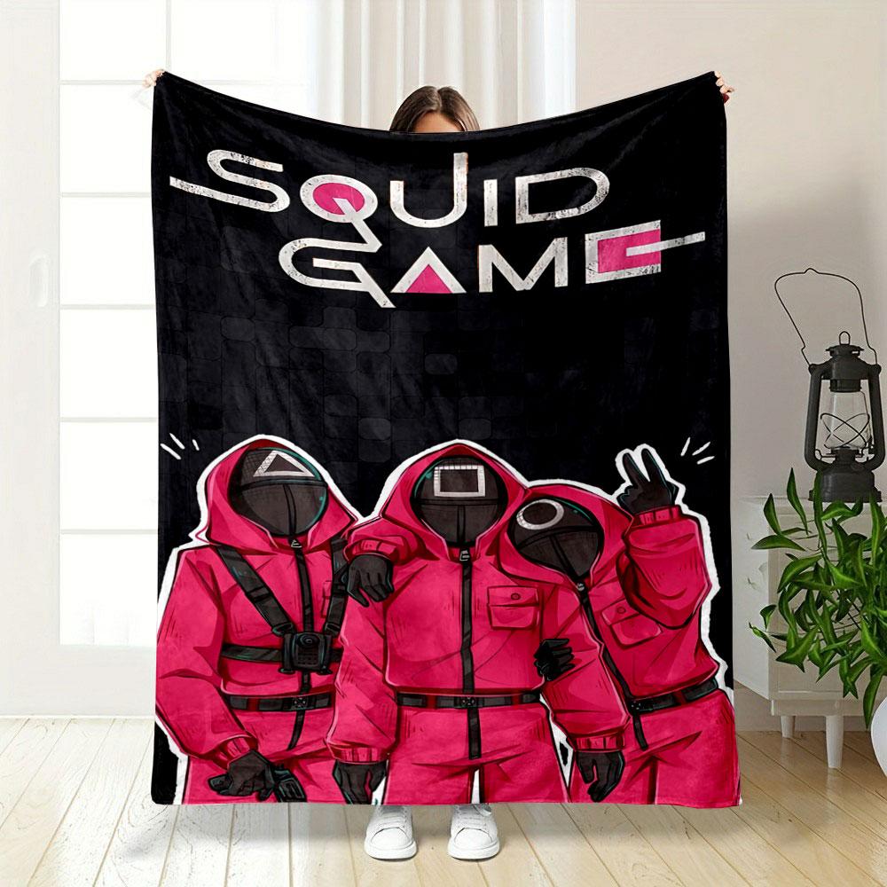 Red hooded figures with geometric masks on a dark tiled background. for all seasons blanket lunch break throw gift