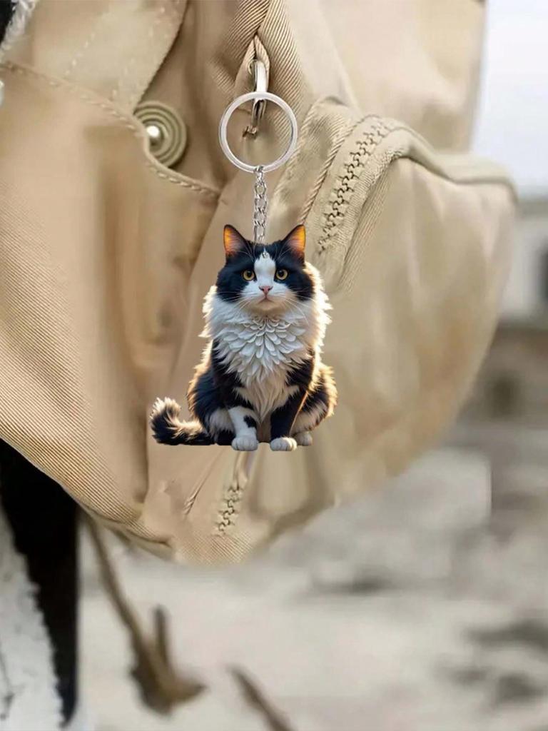 A cute black and white classic style cat keychain animal themed backpack decoration car key pendant pet enthusiast gift
