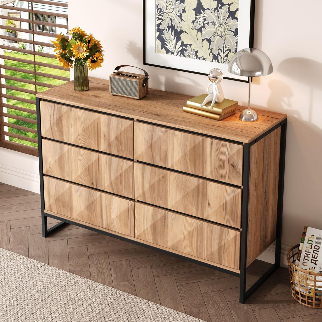 The sideboard and the chest of drawers are characterized by a combination of black and natural wood tones, metal legs and raised doors.