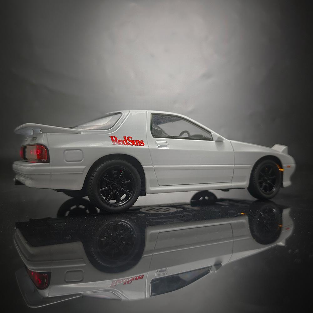Игрушечная легкосплавная машинка Mazda RX-7 1/24 со звуком, светом и рулевым управлением — детская модель в подарок.