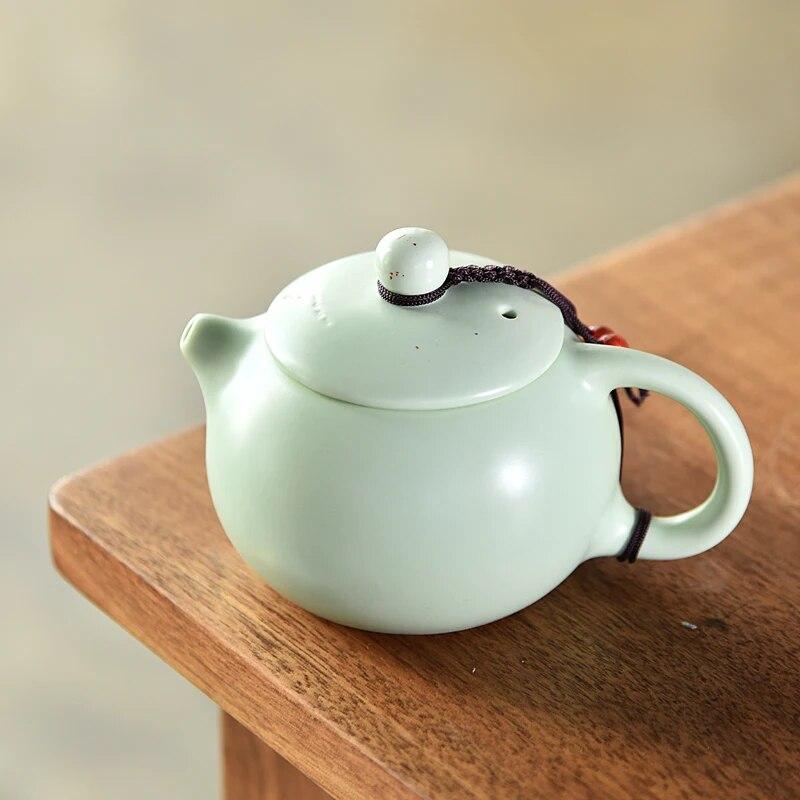 Чайники с кракелюром цвета селадона, традиционный чайный сервиз, черный чайник для улуна, керамический чайник, посуда для напитков с цветущим цветком