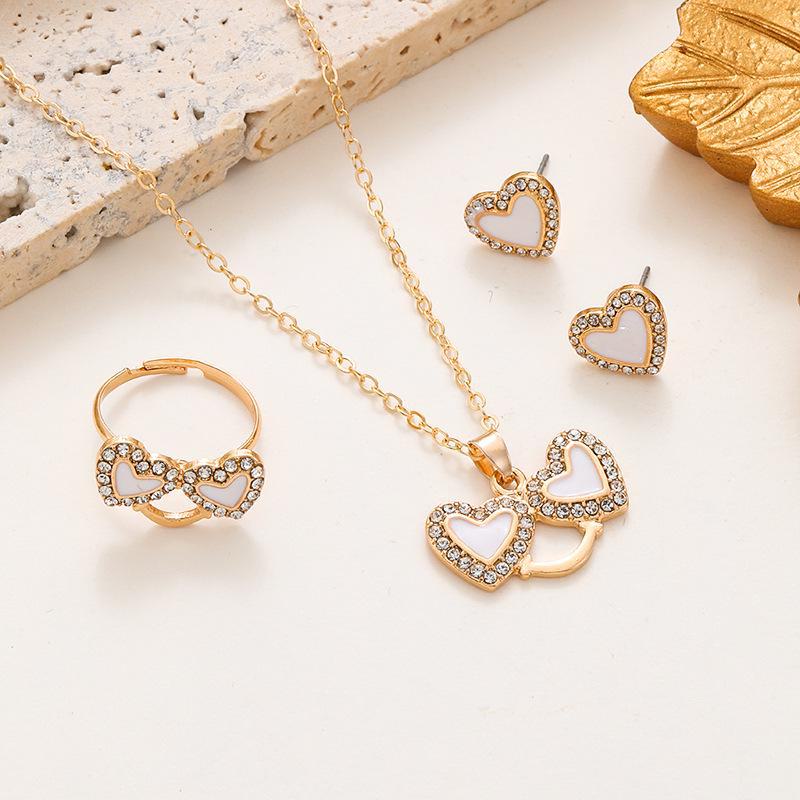 Temu Oil-Drop Heart Jewelry Set: Diamond-Studded Smiley Necklace with Trendy Peach Heart Ring & Earrings for Women