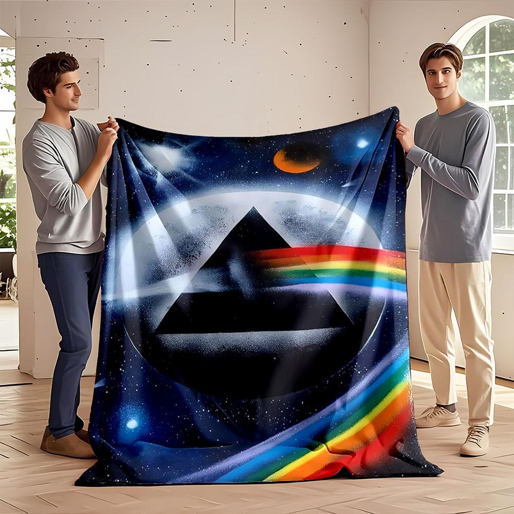 A black triangle with a rainbow beam amidst a cosmic space background. for all seasons blanket lunch break throw gift