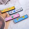 16-Hole Cartoon Tin Harmonica: Double Row Musical Toy for Children's Music Interest
