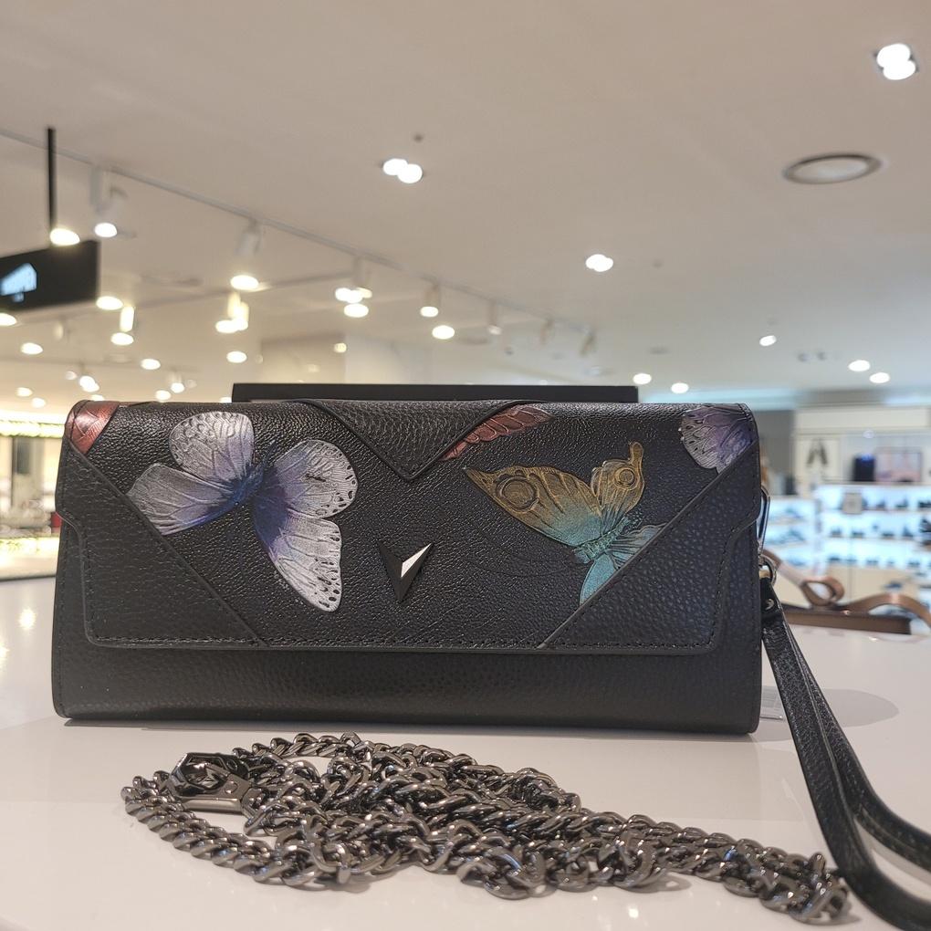 Mari Eclaire's favorite luxury mini clutch bag made of natural cowhide leather with ample storage space.