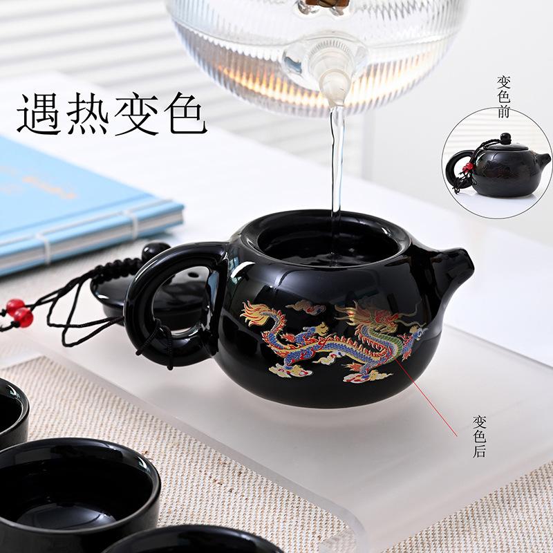 Color-changing dragon and phoenix kung fu tea set, a complete set of cowhide boxes, a pot of four cups of teapots, a gift for making teapots, small