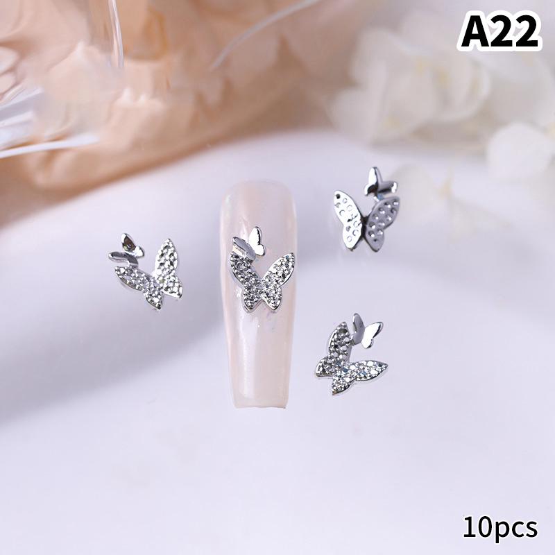 10 шт./пакет в форме бабочки, звезда, цветок, подвеска для ногтей, серебряный сплав для ногтей, жемчужные украшения, аксессуары, принадлежности для ногтей