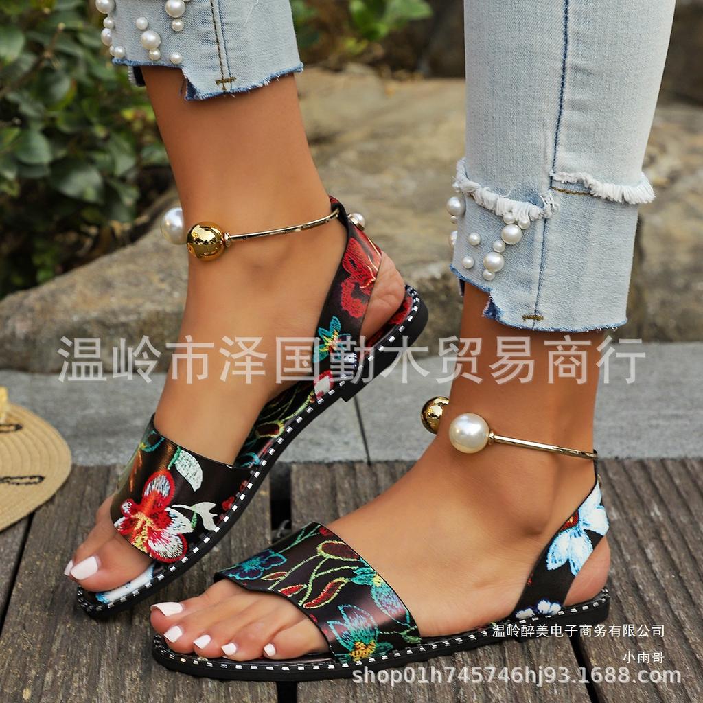 European and American one-word buckle flat sandals women's new open-toed simple pearl metal buckle cool slippers