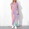 Women Plus Size Printed Scrub Set Crisscross Cutout Neck Short Sleeve Top Long Pants With Pockets