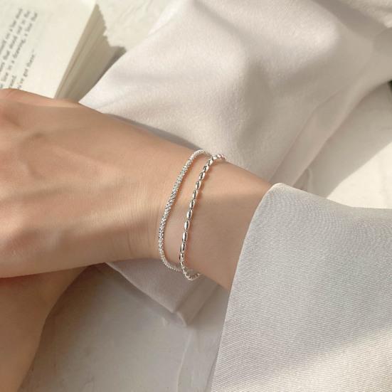 Женский браслет двухслойный регулируемой длины с удлиненной цепочкой из полой меди