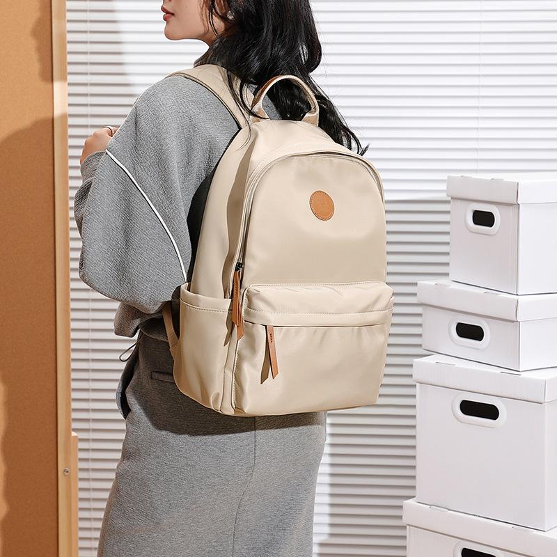 Large-capacity Oxford cloth backpack for women, lightweight and versatile, new commuter backpack, Korean version, solid color travel backpack
