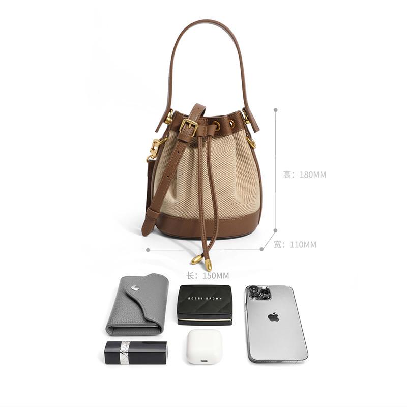 Niche design bucket bag women's 2025 new trendy high-end sense of work small bag portable messenger canvas bag