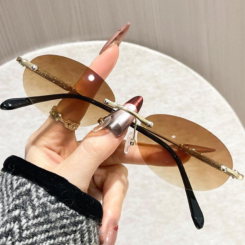 New Fashion Women'S Oval Metal Sunglasses Trendy Frameless Cut Edge Small Circular Eyeglasses Uv Protection Eyewear