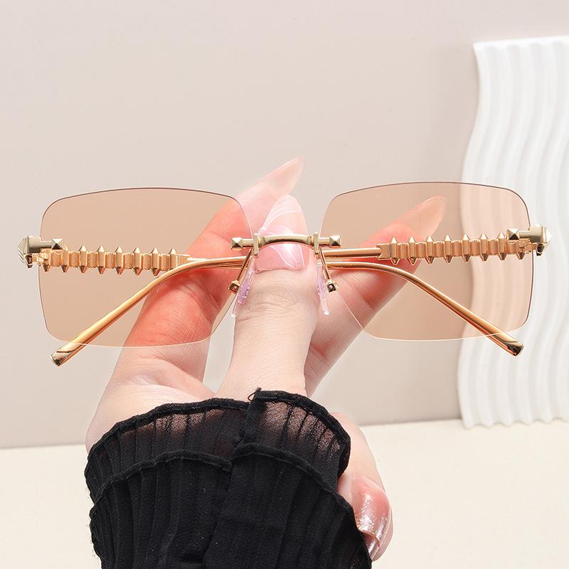 New frameless premium metal rivet leg sunglasses fashionable vacation driving sunscreen women's sunglasses