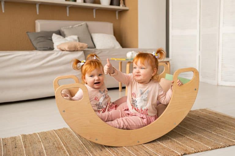 Wooden rocker multicoloured Sunny pink-grey