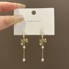 Bow pearl fringed earrings women's high-end temperament super fairy long ear buckles European and American retro personalized ear jewelry