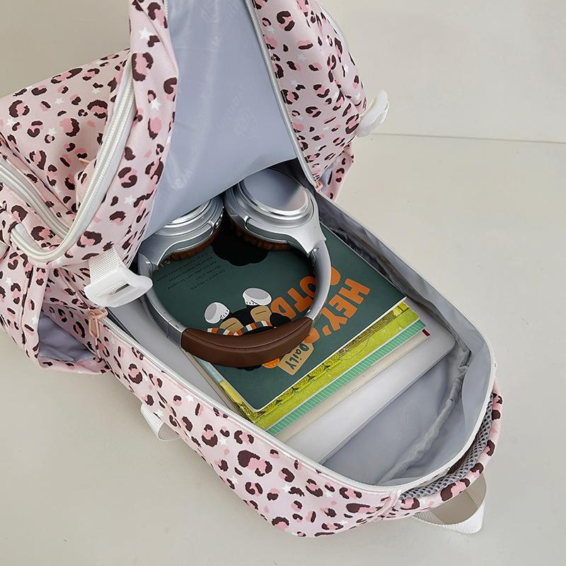 Schoolbag school bag niche girls junior high school students multi-color leopard print 1011 new backpack high value light large capacity backpack