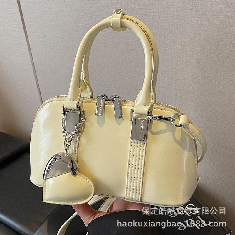 Корейская версия нишевый дизайн простой и универсальный портативный сумка-мессенджер для поездок на работу женская весна 2025 новая модная повседневная сумка-мессенджер