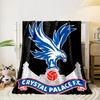 A blue eagle atop a red football, with a palace structure in the background. for all seasons blanket lunch break throw gift