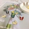 Korean exquisite micro-inlaid zircon stud earrings, full zirconium butterfly earrings, sapphire blue-green earrings, high-end silver needles.