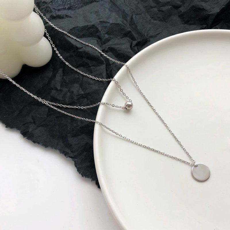 Корейская версия двухслойного ожерелья с цепочкой на ключицу для женщин, модный нишевый дизайн, простой легкий роскошный круглый фирменный кулон, подарок