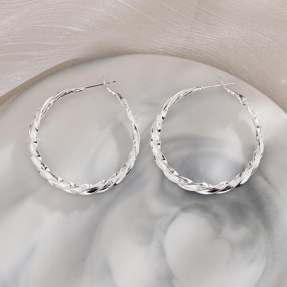 Серьги-пряжки Twist Mobius с застежкой-молнией Personality Flow Fashion Retro Round Circle Earrings Wholesale
