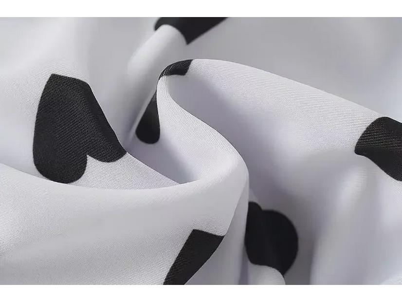 2024 Korean Girl's One-Piece Swimsuit: Black & White Heart with Bow and Lotus Leaf Sleeves.