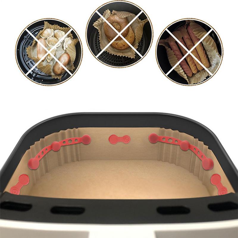 Высокотемпературная силиконовая застежка для крепления вкладыша из пергаментной бумаги в аэрогриле предотвращает его закрытие продуктами.