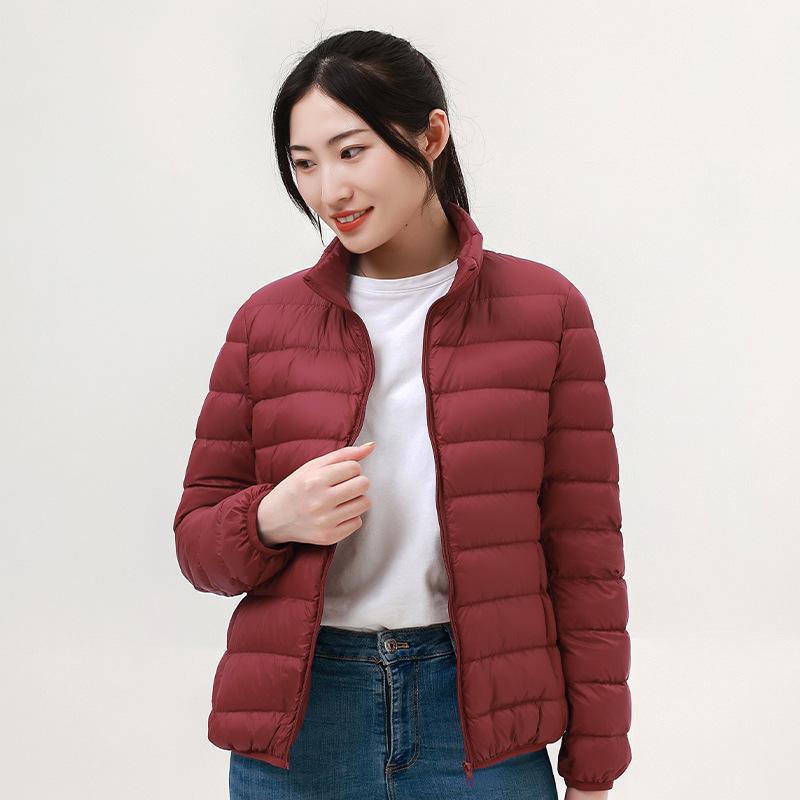 Autumn and winter new women's light stand-up collar hooded down jacket white duck down women's slim fit large size light jacket