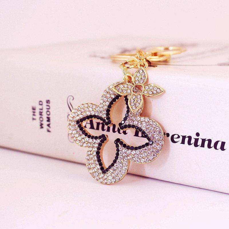 Exquisite Four-Leaf Clover Alloy Keychain Charm - Perfect Gift for Girlfriend, Bag Accent, or Keyring Accessory.