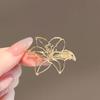 High-End Brooch Women'S Metal Hollow Lily Niche Design Advanced Sense Anti-Light Brooch Pin Buckle Light Luxury