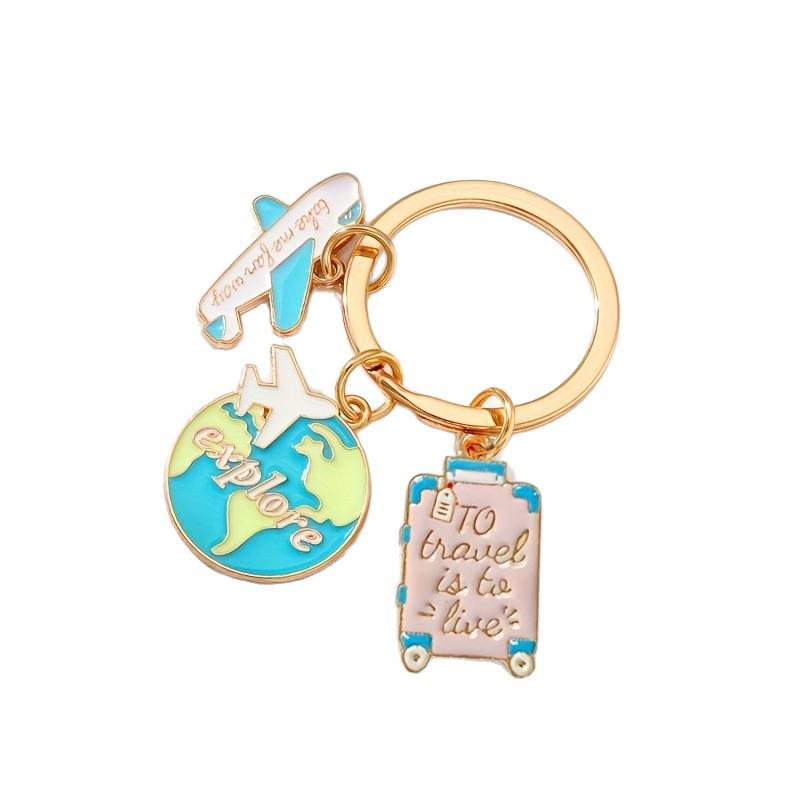 Airplane Crossing Earth Keychain with Engraved Pendant