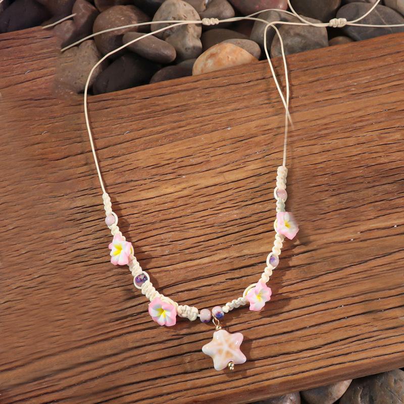 Bohemian vacation style egg flower necklace earrings set ins niche flower soft pottery color collarbone chain tide