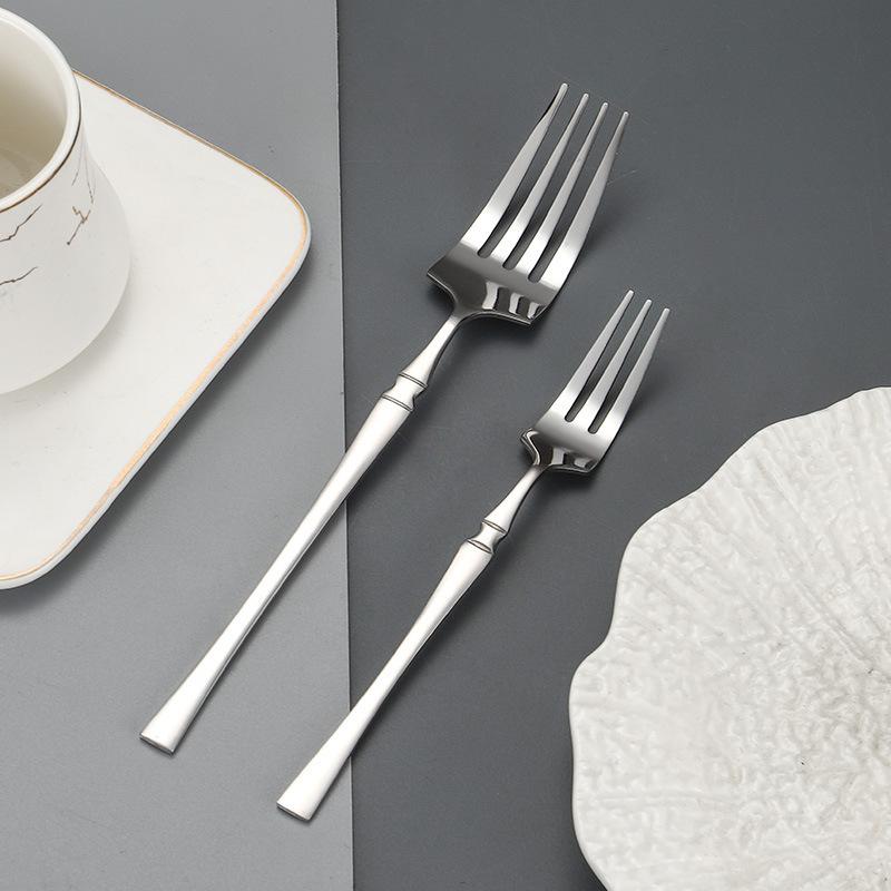 Западные ножи и вилки Столовая посуда Узкая талия Набор ножей и вилок для стейка Нержавеющая сталь Бытовой Премиум Пищевая ложка Десертная ложка и вилка