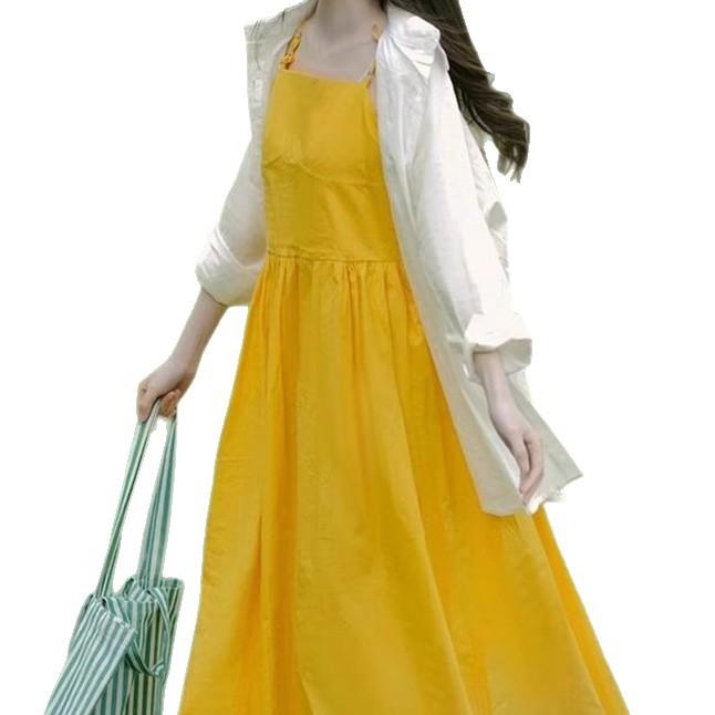 Women's yellow sleeveless dress, perfect for summer beach vacation photos; stylish maxi dress