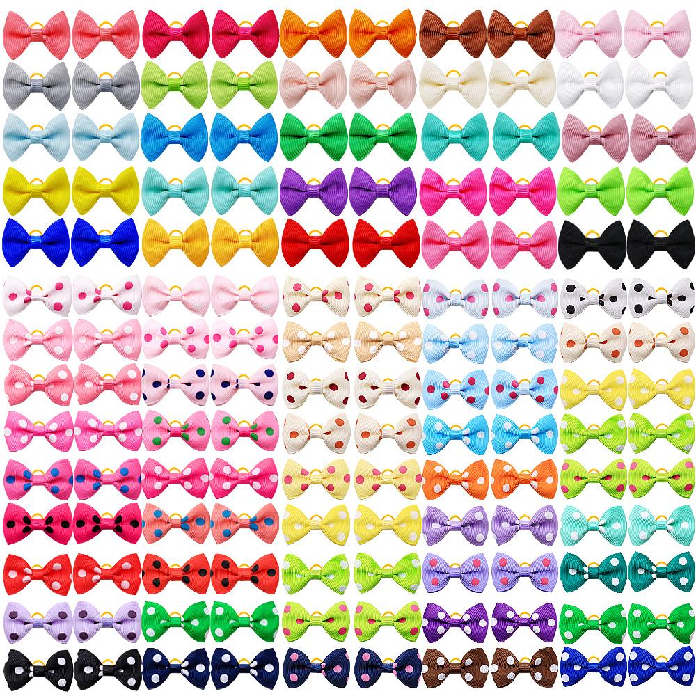 100PCS New Dog Bows With Rubber Bands Solid Polka Dot Style Handmade Puppy Bows Hair Supplies Pet Grooming Accessories For Dogs