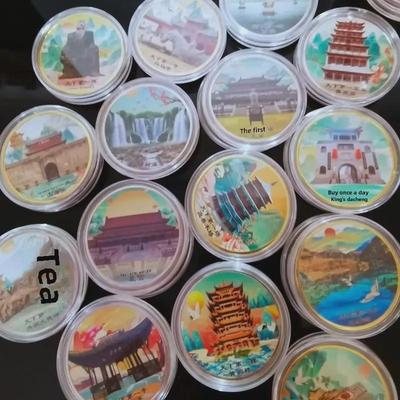 Памятные монеты и марки с живописными видами: Западное озеро, Башня желтого журавля, Запретный город, Достопримечательности Цзючжайгоу