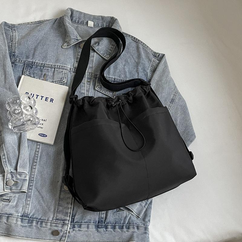 2024 New Japanese Solid Color One Shoulder Underarm Bag Folded Simple Drawstring Lightweight Casual Commuter Double Shoulder Bucket Bag