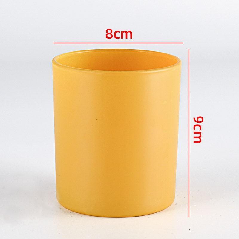 Стеклянная ароматическая свеча в цветном стакане с крышкой