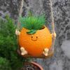 Creative Multifunctional Orange Swing Planter Pot With Swing Feature Suitable for Kids Entertainment and Home Gardening