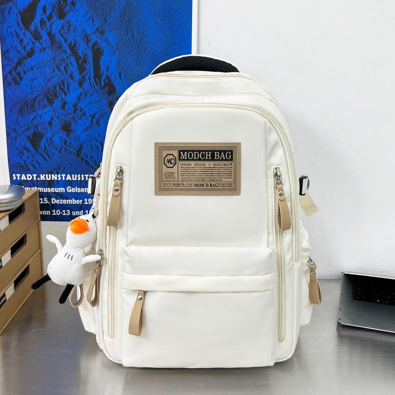 Schoolbag is specially designed for new schoolbags, female students, nylon retro simple, junior high school students, male large-capacity couple .