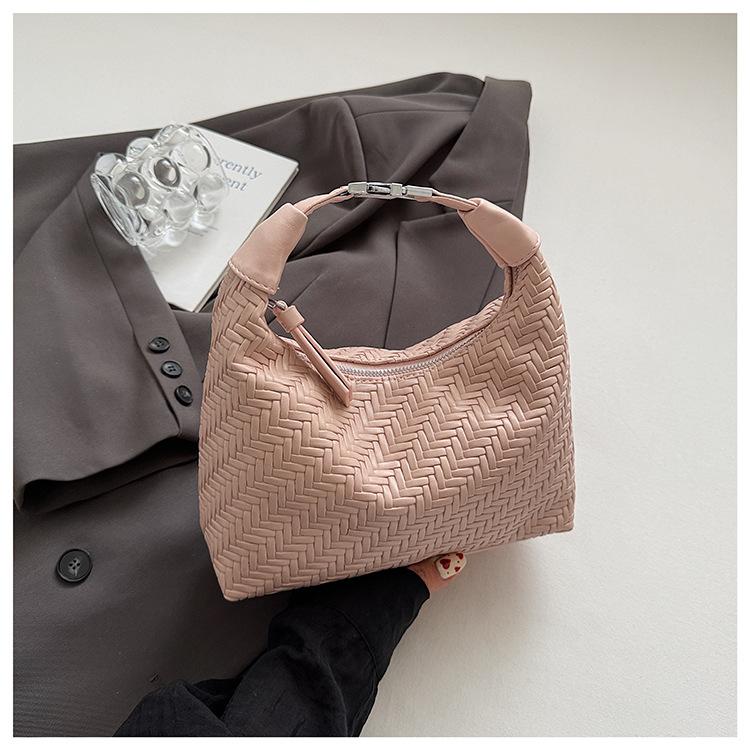 French niche woven pattern handbag women's 2025 spring and summer simple and elegant dumpling bag commuter texture messenger bag