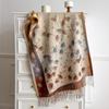 Women's vintage floral jacquard scarf—a large, faux-cashmere wrap featuring contrasting-color tassels, suitable for layering.
