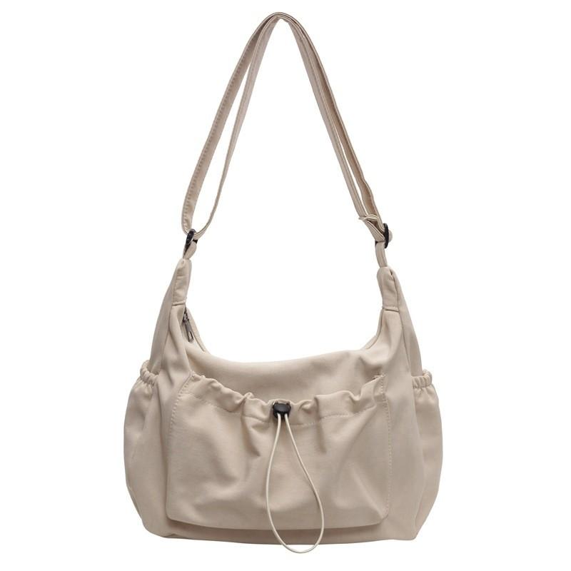 Canvas Ladies Crossbody Bag With Solid Color Drawstring Design For Daily Use And Urban Style