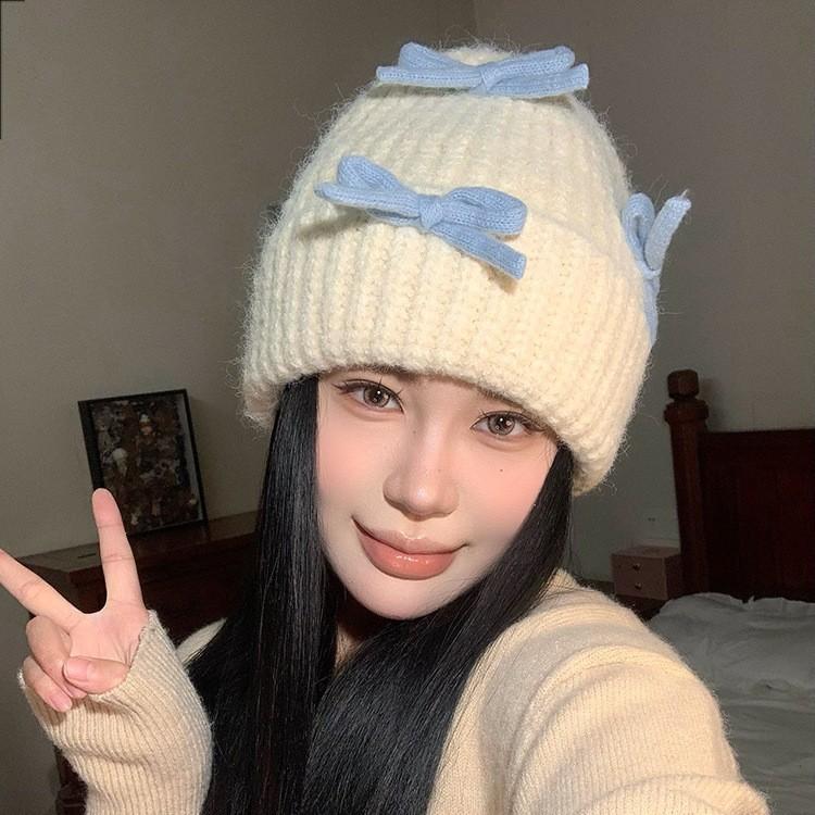 Вязаная шерстяная шапка с бантом для женщин на осень и зиму, теплая и универсальная, утолщенная защита ушей, шапка, подчеркивающая маленькое лицо