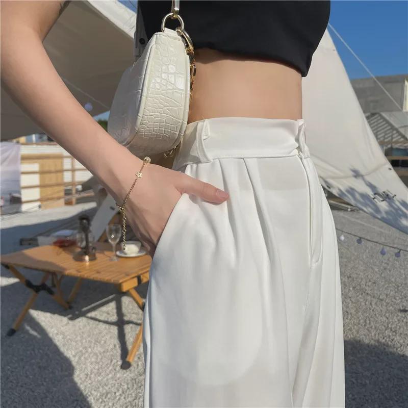 Женские белые широкие летние брюки с высокой талией — узкие, драпированные, прямые и свободные.