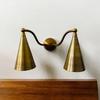 Elegant Dual Brass Wall Sconce Mid-Century Modern Double Light Fixture with Raw Brass Cone Shades Stylish Italian Bedrooms