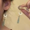 Chinese Jade Moon Tassel Earrings: Unique Design & Elegant Trend