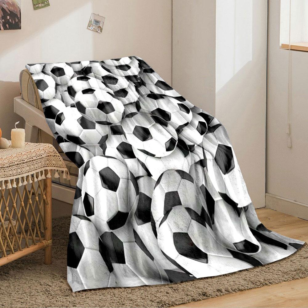 The main pattern is a dense arrangement of black-and-white soccer balls. for all seasons blanket lunch break throw gift